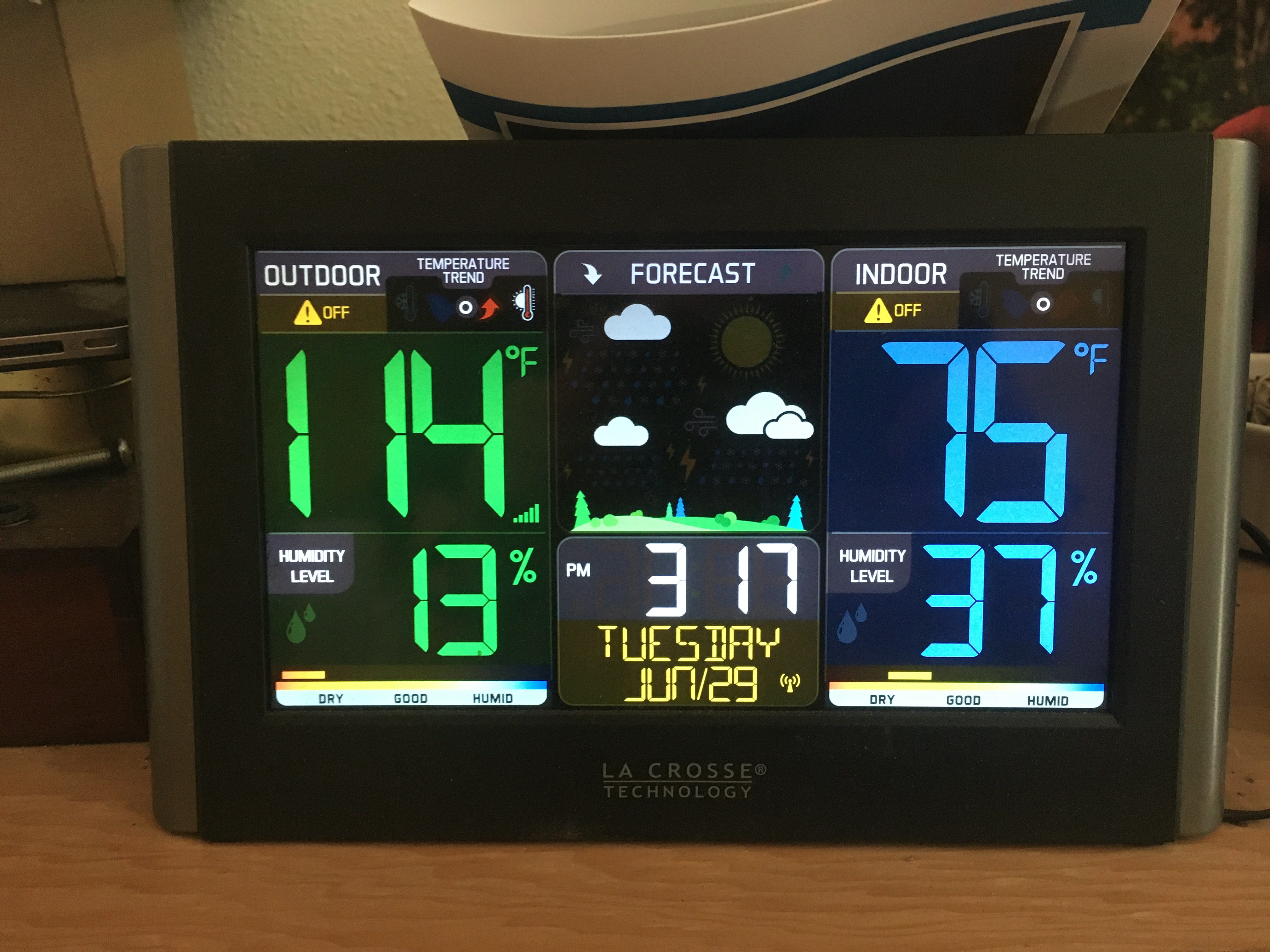 An indoor temperature monitor,
showing outdoor temp (114 F) and indoor (75). Sheesh!